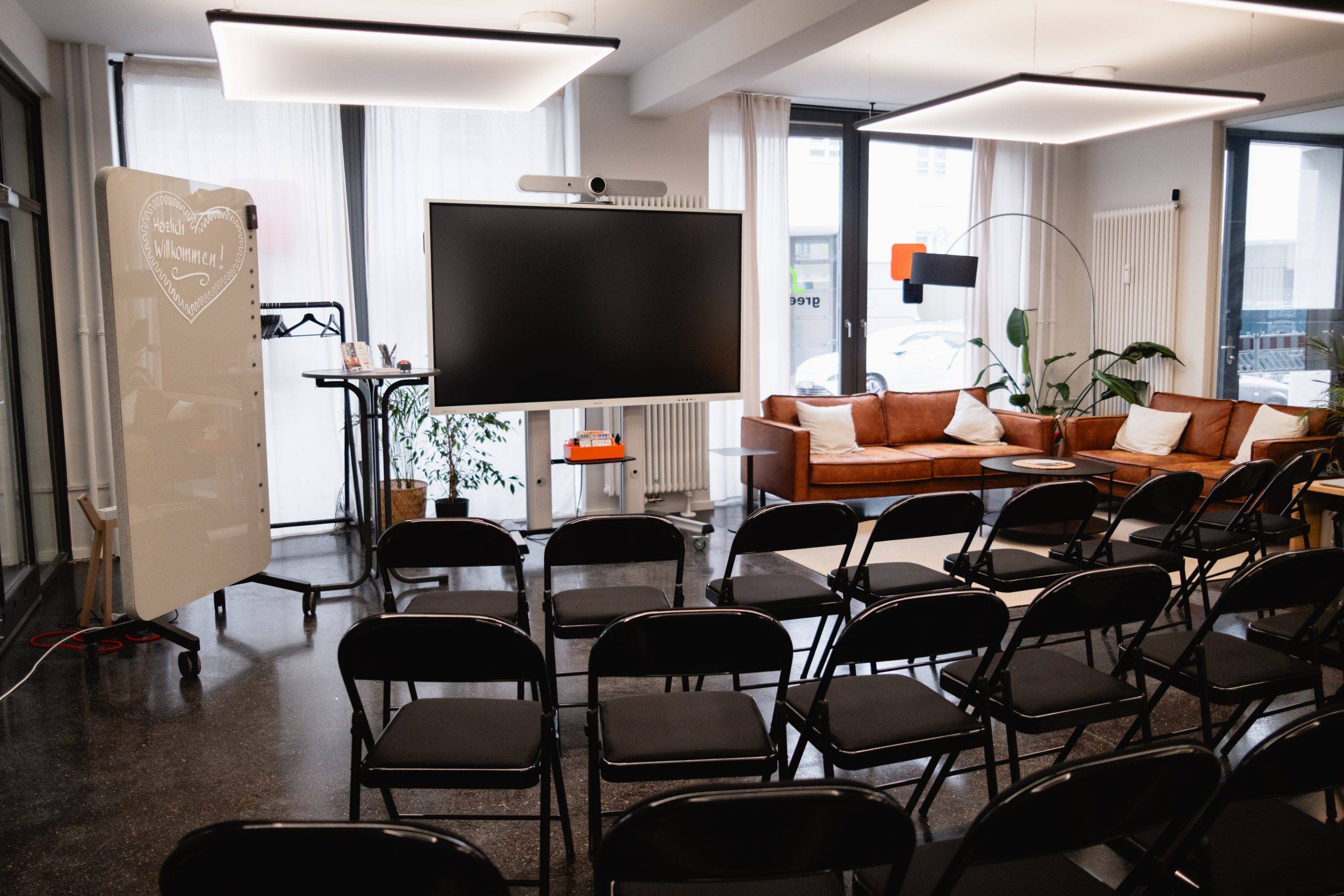 Meeting room with whiteboard and screen